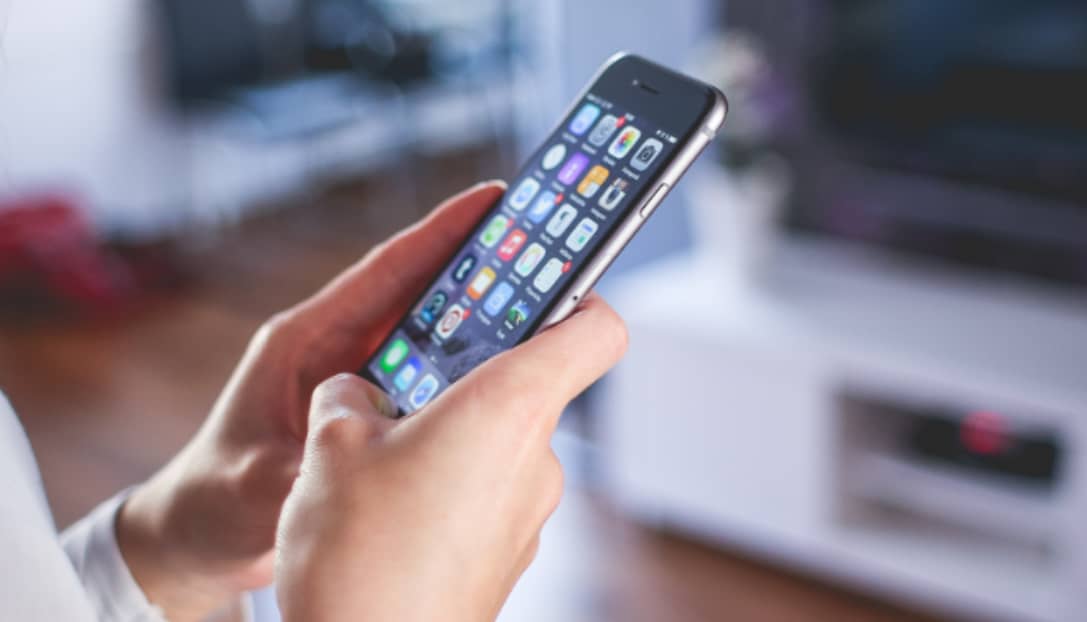 holding an iPhone