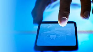 hand touching phone screen