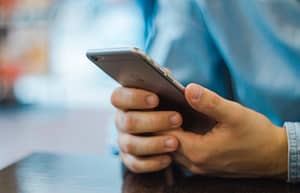 holding an iphone